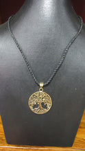 Load image into Gallery viewer, Brass Tree of Life pendant on leather